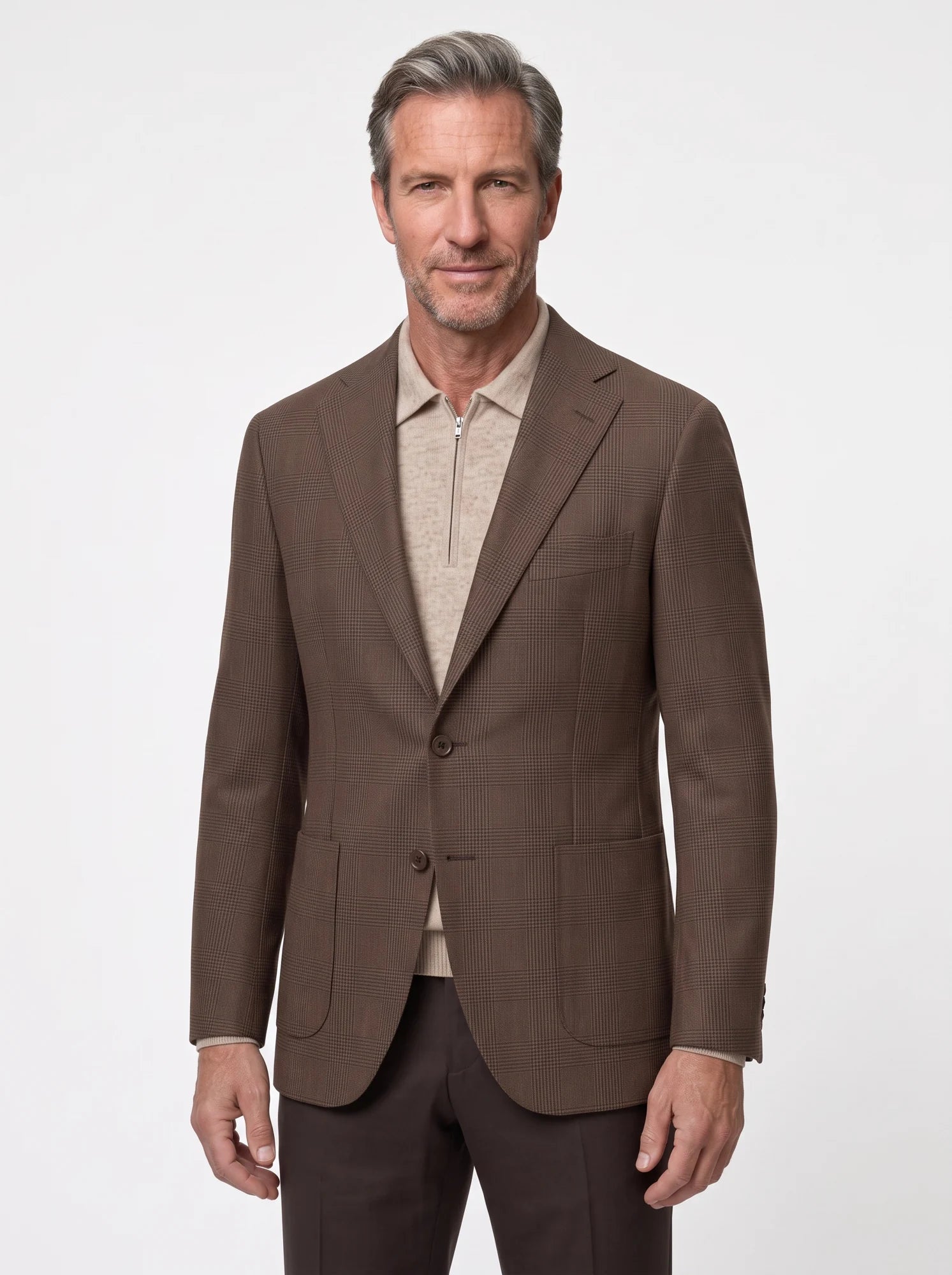 A considered combination of brown tailoring and neutral knitwear